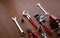 Assorted red tool set, screwdriver, pliers, saw