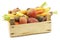 Assorted root vegetables in a wooden crate