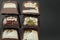 Assorted set of chocolate case candies with vanilla praline filling and jelly berry cherry lemon mango and chocolate close-up on a