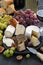 Assorted soft delicacy cheeses and appetizers to wine, top view
