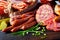 Assorted spicy seasoned sausages with fresh chives