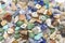 Assorted stone beads. Colorful mixed miniature scale minerals, full-frame