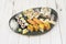 Assorted sushi mix tray with salmon nigiri, uramaki california roll, tuna , wasabi and