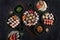 Assorted sushi set served on dark stone slate background. Top view