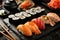 Assorted sushi. Sushi set on slate served with soy. Japanese cuisine