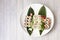 Assorted sushi tray with maki, hosomaki, california uramaki, bean sprouts