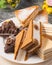 Assorted sweets on a plate: souffle cakes and brownies with chocolate and nuts