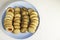 Assorted tea pastes on a blue plate from above