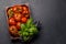 Assorted tomatoes in rustic crate