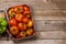 Assorted tomatoes in rustic crate