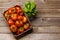 Assorted tomatoes in rustic crate