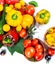 Assorted tomatoes and vegetables isolated on white background. P