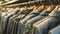 Assorted tweed jackets on wooden hangers in a retail clothing store