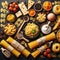 Assorted types of pasta on black background. Top view. Various forms of pasta