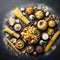 Assorted types of pasta on black background. Top view. Various forms of pasta