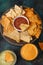 Assorted from various types of potato chips and pita chips, snacks for parties and parties, with salsa and dip. Fast and tasty