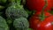 Assorted vegetables rotating on white background