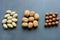 Assorted Walnuts, macadamia nuts and pecans close-up on wooden table