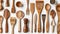 Assorted wooden kitchen utensils on a white background