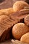 Assortement of bread on burlap on the wooden table. Slices of bread and roll.