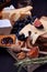 Assortment of appetizers: different sorts of cheese, crackers, grapes, nuts, olive marmalade, figs and olives