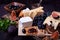 Assortment of appetizers: different sorts of cheese, crackers, grapes, nuts, olive marmalade, figs and olives