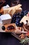 Assortment of appetizers: different sorts of cheese, crackers, grapes, nuts, olive marmalade, figs and olives