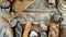 Assortment of baked bread and bread rolls on wooden table background