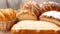 Assortment of baked bread. Loaf of bread with golden crispy crust. Texture bread