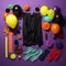 an assortment of balloons streamers and other items on a purple background