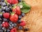 Assortment of berries over a wood table