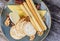 An assortment of cheese and crackers on a round blue plate