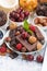 Assortment chocolate, berries and nuts, vertical