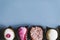 Assortment of chocolates fruit pastes and dried fruits in a grey plate