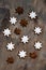 assortment of christmas cookies stars on grey wooden background