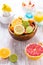 Assortment of citrus fruits on wooden background. Preparing lemonade, ice tea or summer drink