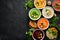 Assortment of colored vegetable cream soups. Dietary food. On a black stone background. Top view.