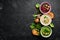 Assortment of colored vegetable cream soups. Dietary food. On a black stone background. Top view.