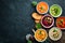 Assortment of colored vegetable cream soups. Dietary food. On a black stone background. Top view.