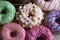 Assortment of colorful frosted doughnuts. Glazed sprinkles with