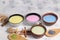 An assortment of colorful latte Japanese tea, matcha green, blue, pink moon milk, golden milk, ginger and cinnamon, top view. A