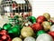 assortment of colorful sparkly Christmas balls in disco ball reflection