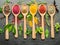 Assortment of colorful spices in a wooden spoons.