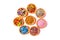 Assortment of confectionery sprinkles, in tartlets, themed sugar decorations , top view, on a white background,