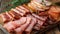 Assortment of cured ham slices on vintage wooden table for a rustic presentation