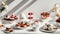 an assortment of delectable desserts beautifully arranged on a modern white table indoors.