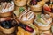 Assortment of delectable pastries with fresh fruit arranged atop a metallic serving tray