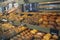 Assortment of delicious freshly baked sweet and puff pastry for sale on counter of shop, grocery, market