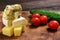 Assortment of different cheese type on a wooden board. Different pieces of cheese, blue cheese, moldy cheese, camembert and