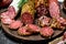 Assortment of different salami with spices and herbs